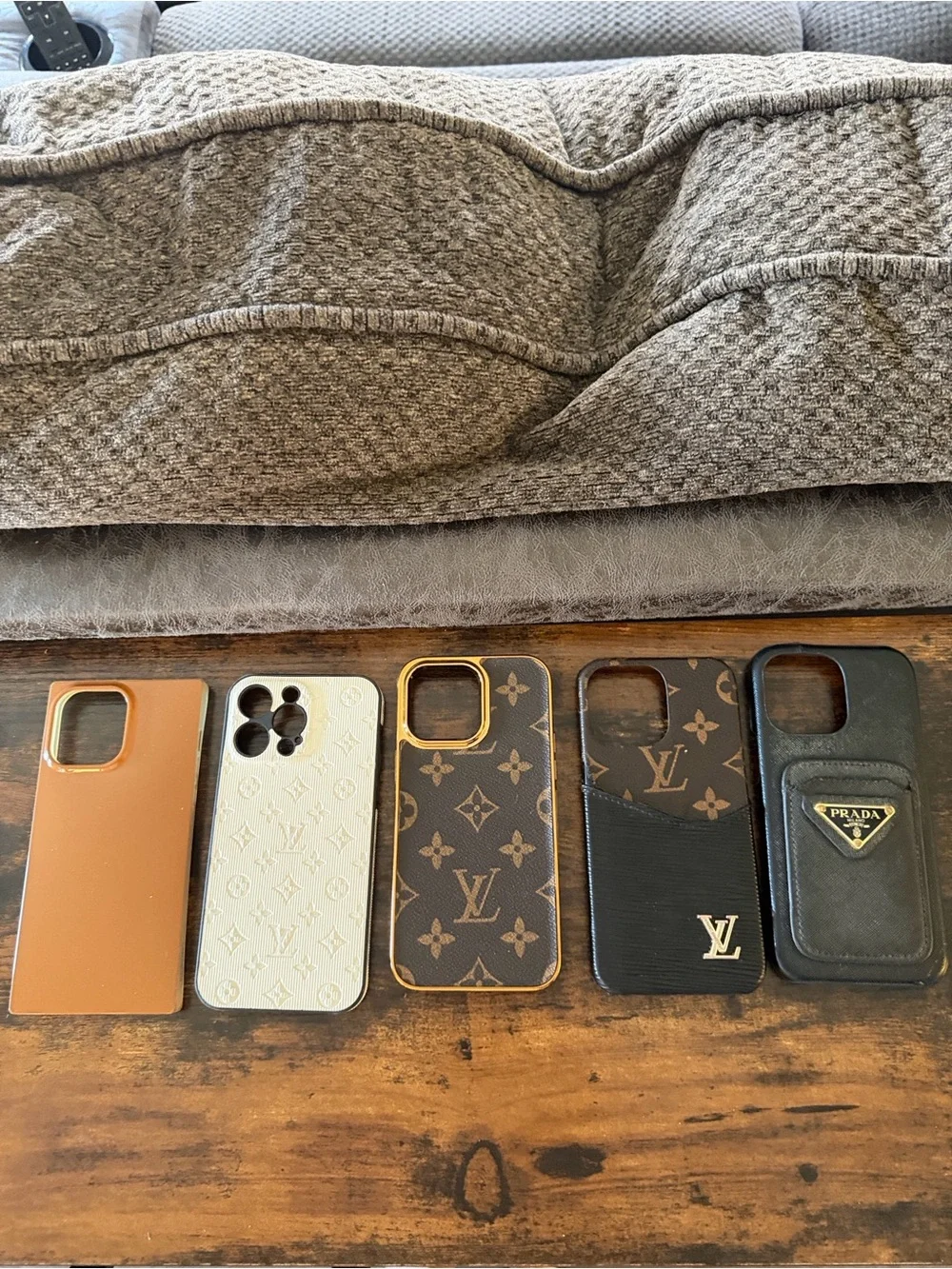 5 - iPhone 14 Pro Max cases. The brown one to the left is a flaunt case.